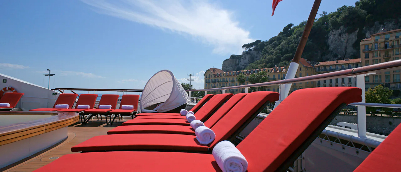 Comfortable lounge beds by the pool.